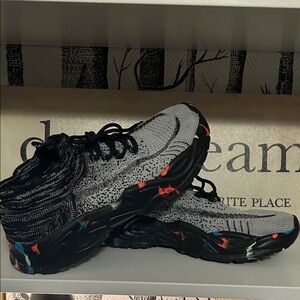 Stylish Black and Gray Sneakers with Colorful Accents size 42